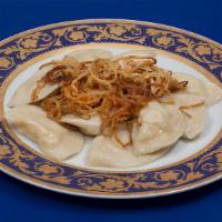 Potato Vareniki · Small filled potato dumplings garnished with fried onions and drizzle of butter.