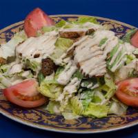 Caesar Salad · Romaine lettuce, grilled chicken, and croutons with a homemade Caesar dressing.