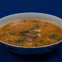 Kharacho Soup · Mildly spiced tomato soup with rice and meat.