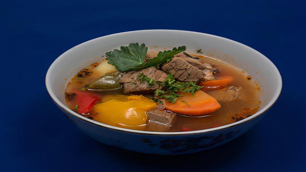 Shurpa · Light broth soup with meat and vegetables.