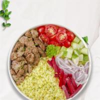 Beefy Dash Rice Bowl · Skewered pieces of top sirloin marinated in a blend of herbs and spices served with yellow r...