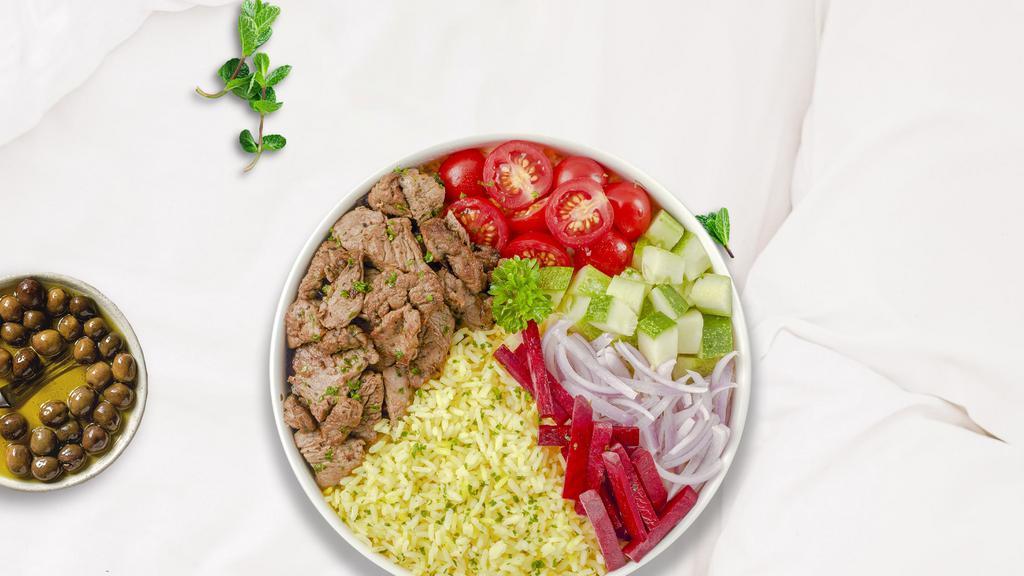 Beefy Dash Rice Bowl · Skewered pieces of top sirloin marinated in a blend of herbs and spices served with yellow rice and mixed vegetables.