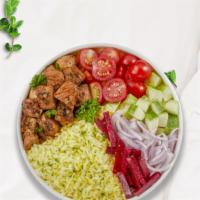 Chatty Chicken Rice Bowl · Skewered pieces of chicken breast marinated in a mediterranean blend of herbs and spices ser...