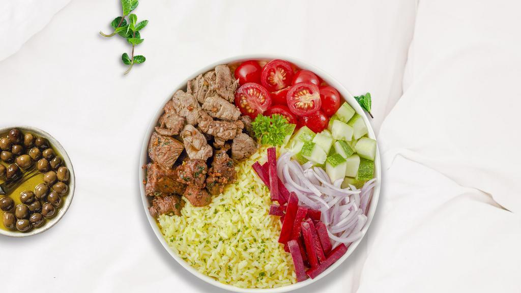 Silence Of The Beefy Lamb Rice Bowl · Skewered pieces of lamb and beef marinated in a Mediterranean blend of herbs and spices served with yellow rice and mixed vegetables.
