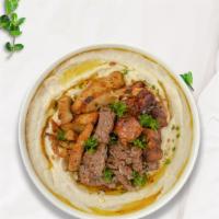 Mighty Meat Combo Hummus Bowl · Skewered pieces of chicken, lamb, beef marinated in a mediterranean blend of herbs and spice...