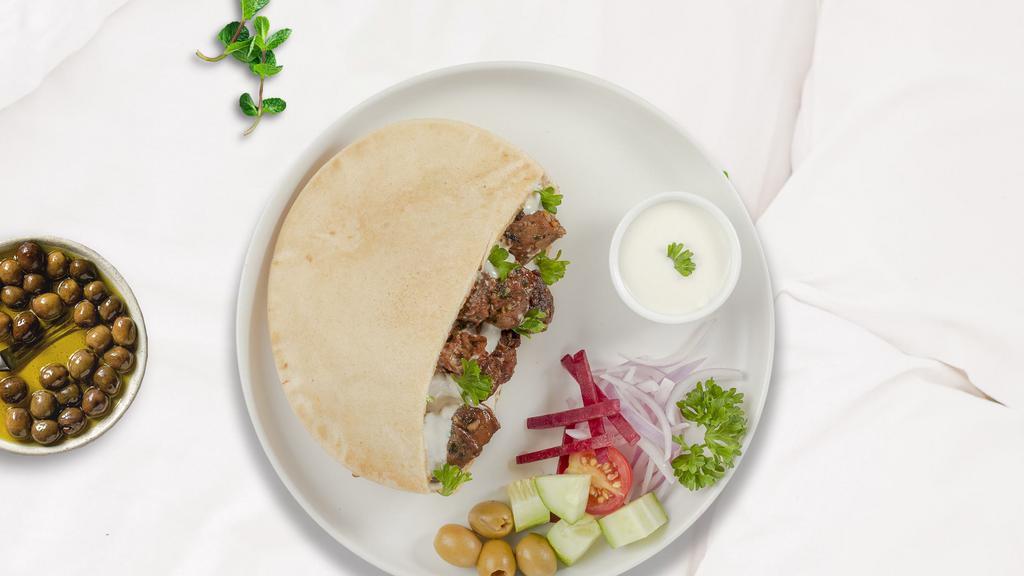 Silence Of The Pita Lamb · Skewered pieces of lamb marinated in a blend of herbs and spices served in a pita pocket