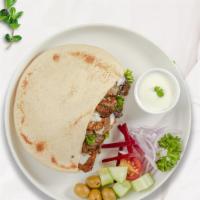 Pita Mighty Meaty Combo · Skewered pieces of chicken, lamb, beef marinated in a mediterranean blend of herbs and spice...