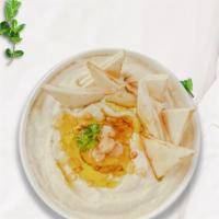 Humor Me Hummus Plate · A mixture of mashed garbanzo beans, lemon juice and tahini, and garlic served with pita bread.