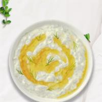 Tiki Tzatziki · Salted strained yogurt with diced cucumbers, garlic, salt, olive oil, lemon juice, and herbs