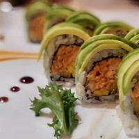 Phoenix Roll · Grilled chopped salmon mixed with eel sauce, mango inside. Avocado on top with eel sauce spi...