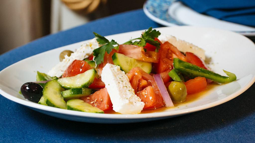 Classic Greek Salad · Vine-ripened tomatoes, cucumbers, olives, green peppers, red onions and feta with red wine vinaigrette.