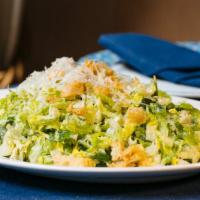 Romaine Salad · Vegetarian. Chopped romaine hearts, house-made oregano croutons, grated feta and kefalogravi...