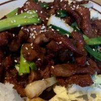 Asumaia Sweet Beef · Marinated sliced Mongolian Beef, green onions, rice.