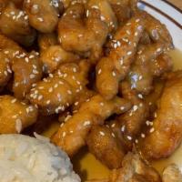 S&S Orange Chicken · Comes with 2 pieces potstickers and 4 piece sushi roll.