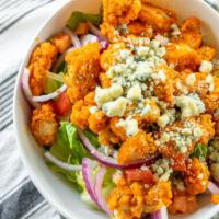 Buffalo Chicken · Romaine lettuce topped with buffalo crispy chicken, diced celery, red onions, bleu cheese cr...