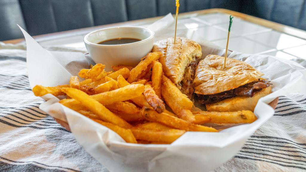 French Dip Sandwich · Philly meat with provolone served on a toasted hoagie and au jus with a side of locals chips and house sauce.