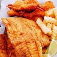 6 Shrimp, 2 Tilapia · Lightly breaded and fried Golden Filet of tilapia and jumbo shrimp, served with two side dis...