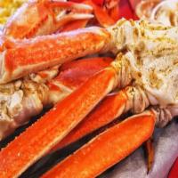 Steamed Snow Crab Legs · Deliciously sweet and tender, our juicy Alaskan Snow Crab legs, served with two side dishes ...