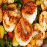 Grilled Shrimp & Scallops With 2 Sides · Jumbo Shrimp and scallops marinaded in a garlic butter and grilled to perfection, served wit...