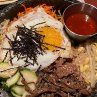 Bibimbap Bowl · Assorted fresh vegetable with fried eggs, spicy chilli sauce topped with rice.