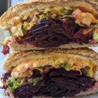 Beet Mac · House pastrami spiced beets, secret sauce, pickles, diced onions, vegan cheese, toasted seed...