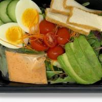 Monk Salad · spring mix, tomato, cucumber, avocado, onion, carrot, boiled egg, peanut dressing.