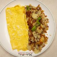 Plain Omelette · Three eggs, home fries or grits.