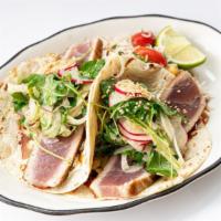 Eel Point · Seared rare tuna in flour tortillas with wasabi creme fraiche, sweet soy glaze, sesame lime ...