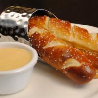 Salted Soft Pretzel · Served with cheddar IPA dipping sauce