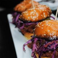 Pulled Pork Sliders · Three sliders with bourbon bbq sauce,
pickles & coleslaw on sesame seed buns