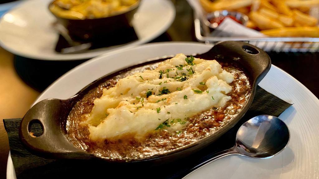 Shepherd'S Pie  · Slow cooked beef, roasted root vegetables, sweet peas & mashed red bliss potatoes