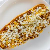 Long Chili Dog · Foot long chili dog on a toasted bun topped with chili, shredded cheese, and chopped onions.