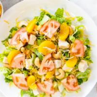 Oriental Chicken Salad · Grilled chicken on a bed tossed garden salad mix topped with quartered tomatoes, mandarin or...