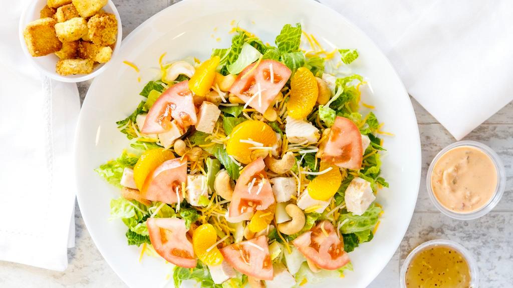 Oriental Chicken Salad · Grilled chicken on a bed tossed garden salad mix topped with quartered tomatoes, mandarin oranges, shredded parmesan, croutons, and cashews. Dressing on the side, your choice of Ranch, Italian, Caesar, Oriental, Bleu Cheese, or 1000 Island