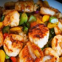 1/2 Lb. Grilled Scallops · Sea scallops marinated in a garlic butter and grilled to perfection, served with grilled veg...