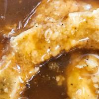 Smothered Pork Chops (2) With 2 Sides · Tender and juicy smothered pork chops in gravy. Served with two side dishes and choice of br...