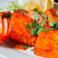 Paneer Tikka · Homemade cheese cubes marinated with yogurt and spices, grilled in a clay oven with chunk of...
