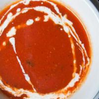 Tomato Soup · Made with fresh tomato, cumin, black pepper, and cilantro.