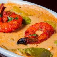 Shrimp Tikka Masala · A delicious preparation of tandoori shrimp cooked in a creamy sauce with onion and green pep...