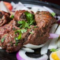 Beef Seek Kabob · A delicacy of minced meat flavored with aromatic herbs, cooked on a skewer in the tondoor. C...