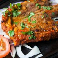 Lamb Chops · Juicy lamb chops marinated in spices and roasted. All time house favorite.