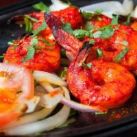 Shrimp Tandoori · Marinate in fresh herbs and spices, served with roasted tomatoes, onions, and green peppers....