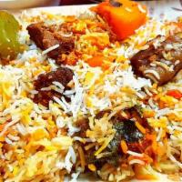 Beef Biryani · Flavorful rice cooked with cubes of beef marinated with Masala, saffron, and spices, served ...