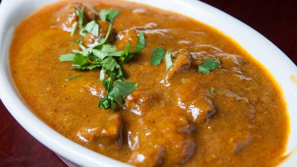 Lamb Or Beef Curry · Boneless meat cooked with fresh tomato, onion, and spice flavored sauce. Comes with side of rice.