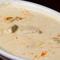 Lamb Korma · Tender pieces of lamb simmered in a cashew, almond and cream sauce