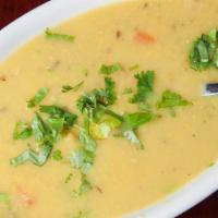 Dal Tadka · Vegetarian. Yellow lentils tempered in butter with crushed tomatoes