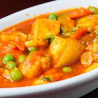 Vegetable Vindaloo · Mixed vegetables cooked with potatoes, vinegar, hot peppers, and spices. Comes with side of ...