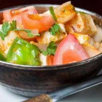 Paneer Karai · Fresh homemade cheese cubes cooked with tomatoes, onion, green pepper, and spices. Comes wit...