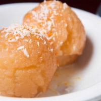 Gulab Jamun · Fried balls of cottage cheese soaked in honey and sugar syrup