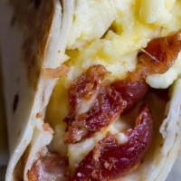 Bacon, Egg, Cheese, Hash Brown Wrap · Enjoy our crispy bacon, egg with cheese, and hash brown wrap. Completely folded with love!
